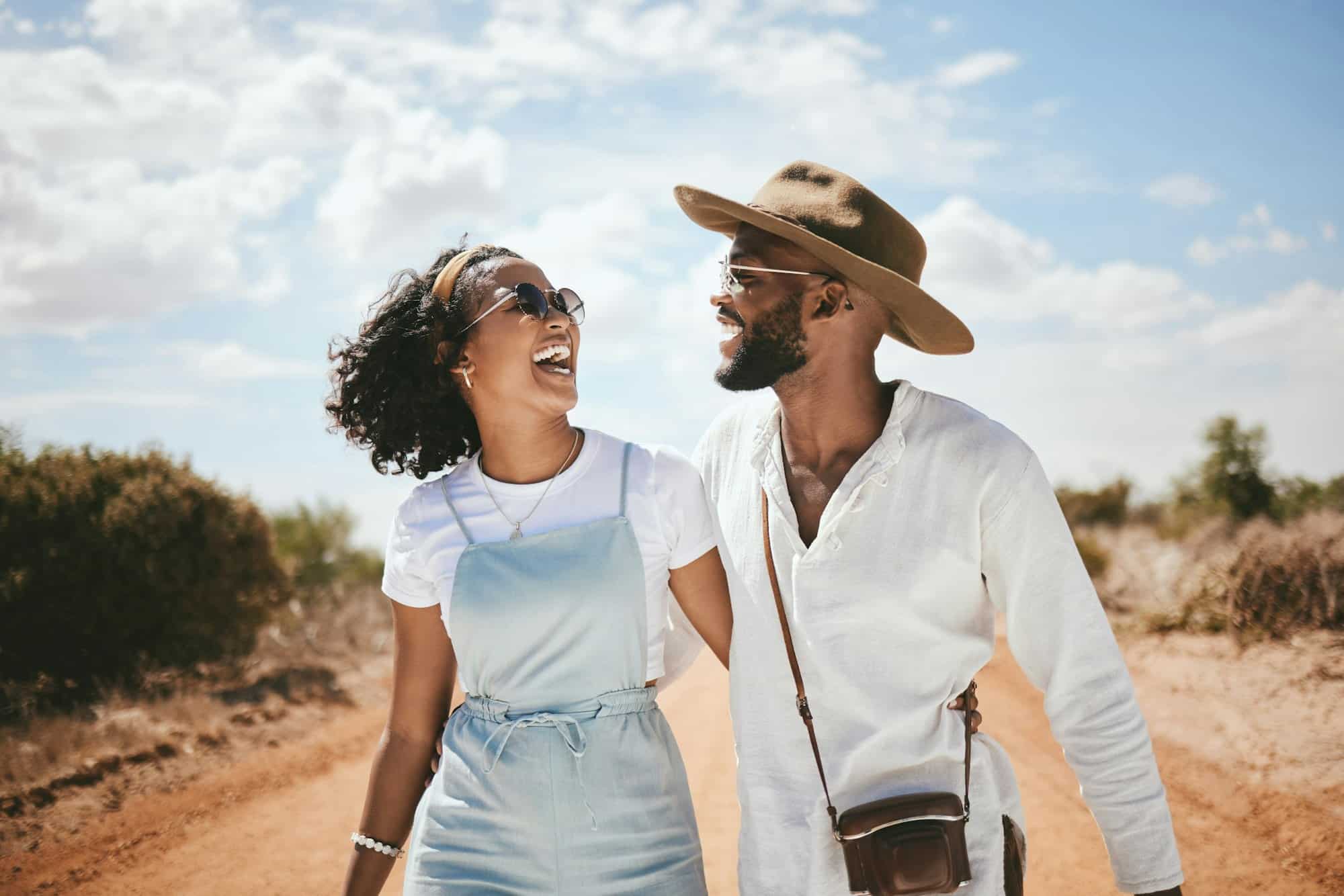 Couple, travel and happy outdoor road trip of black people enjoying nature with love. Happiness of